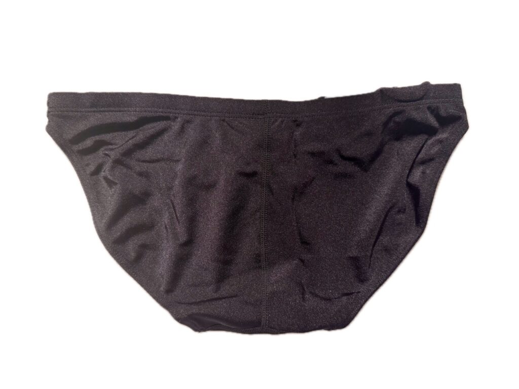 VXA men’s competitive swim brief in glossy black with white logo, back view