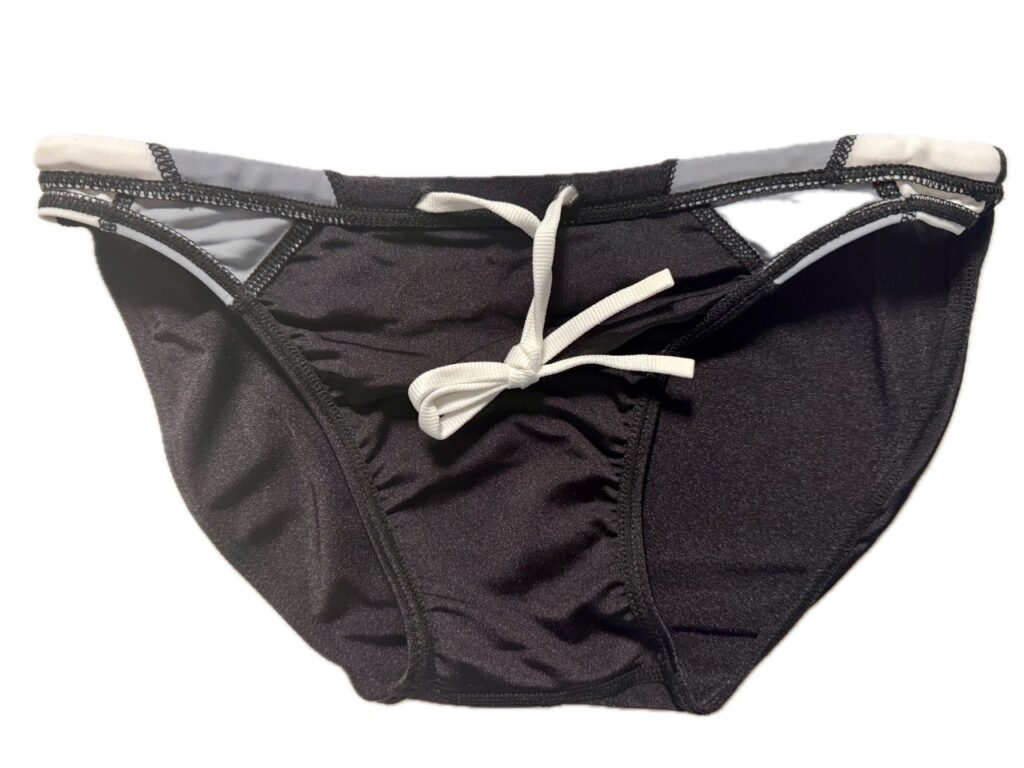 VXA men’s competitive swim brief in glossy black with white logo, front view inside