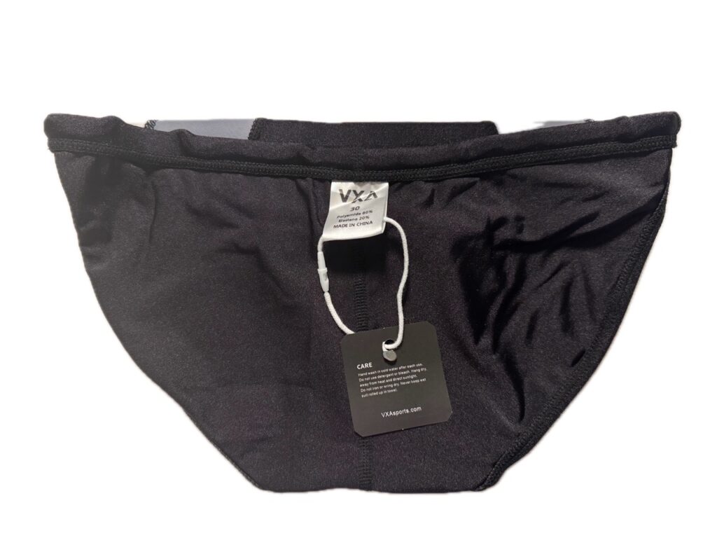 VXA men’s competitive swim brief in glossy black with white logo, back view inside